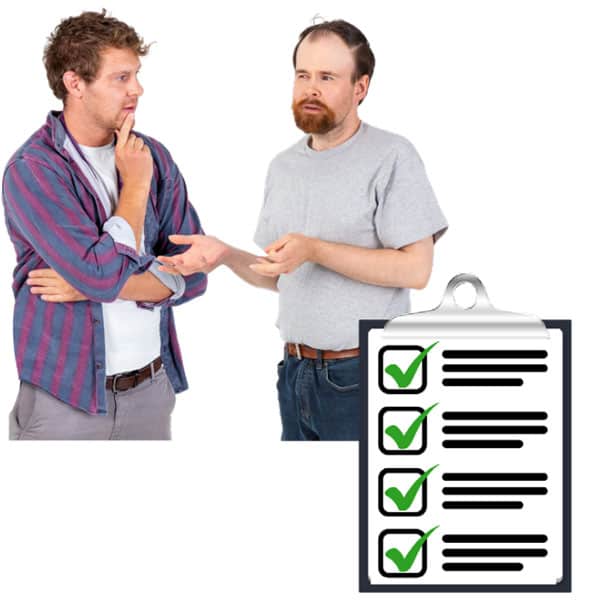 2 people discuss behind a checklist