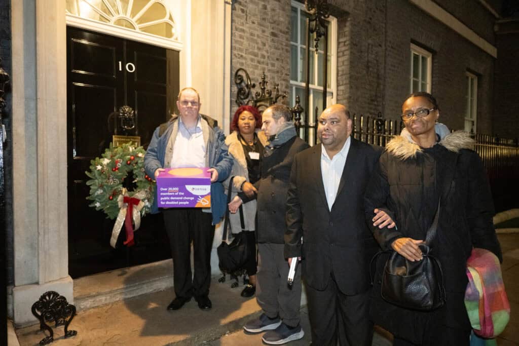Mo, together with other Sense campaigners, handing in a petition calling for action for disabled people at 10 Downing Street.