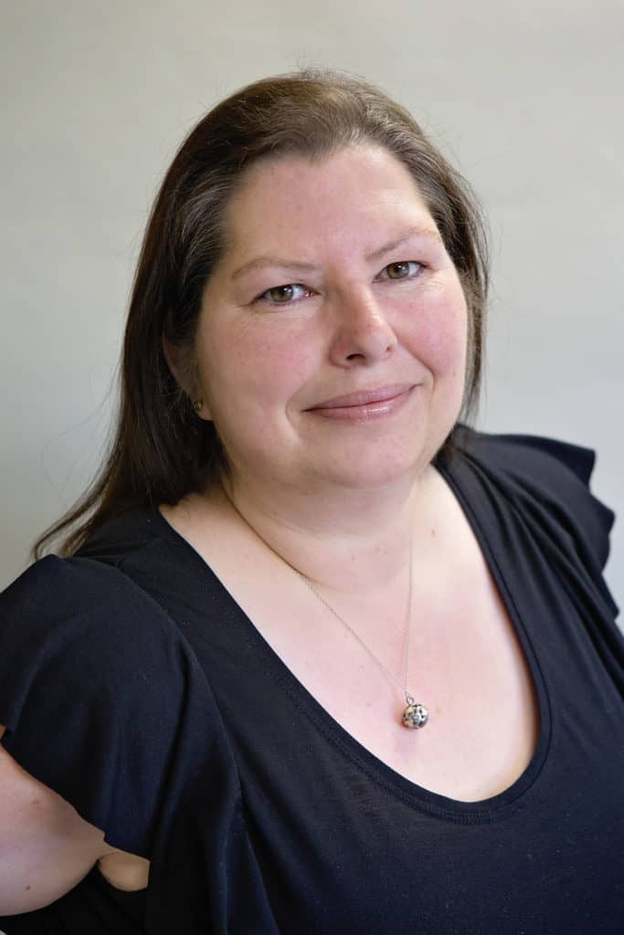 Close-up of Jo Loubser, a white woman with long dark hair.