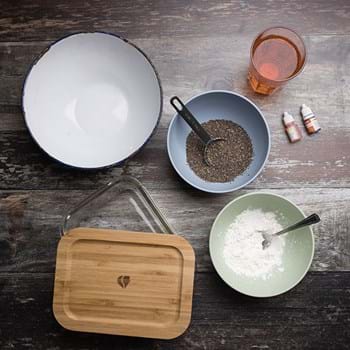The materials needed to make edible slime, including a bowl of dried chia seeds and food colouring