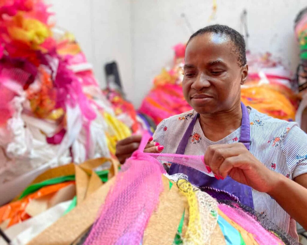 A woman working with different types of fabric.