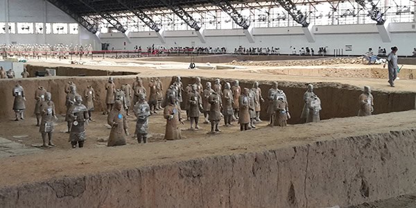 Statues of people on rocks outside