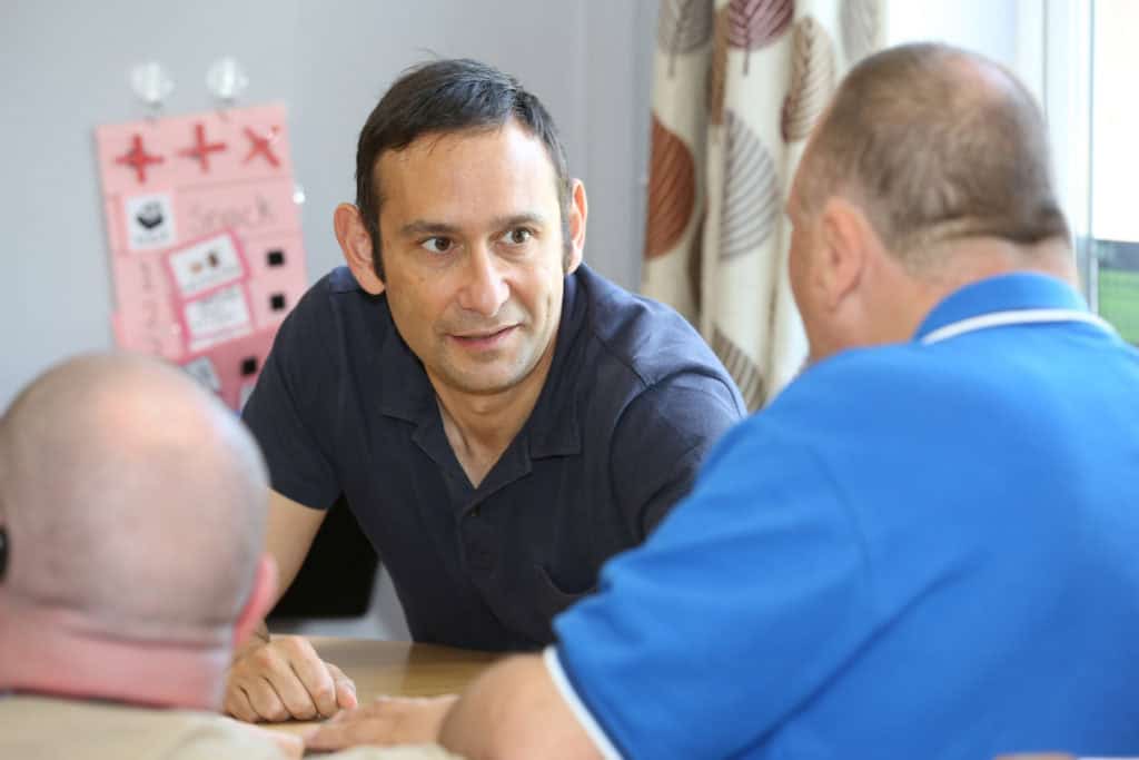 Sense's chief executive, Richard Kramer, in conversation with another man with his back to the camera.