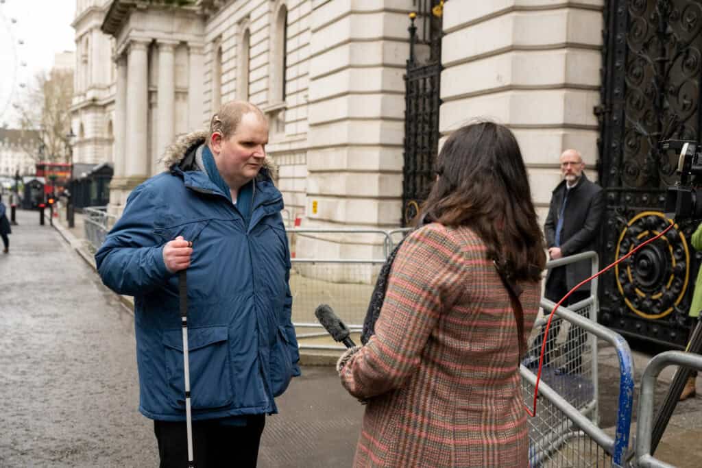 Steven being interviewed by a TV reporter.