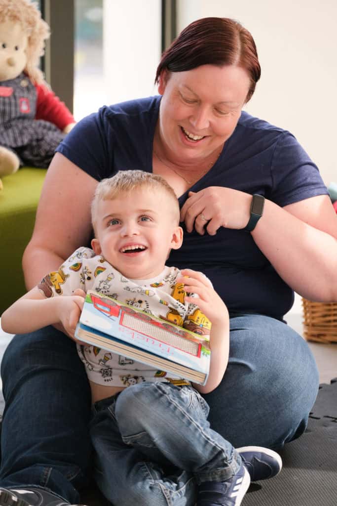 Thomas and his mum laughing together.
