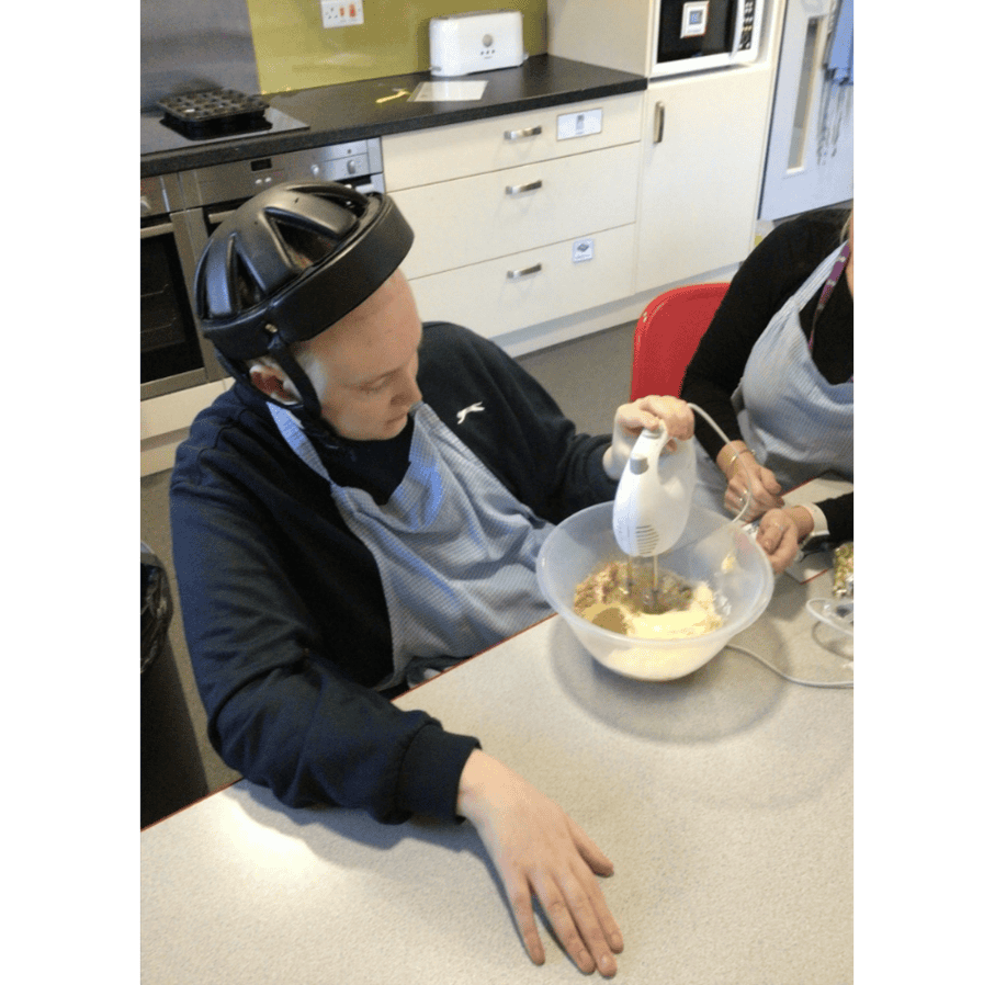 Luke using the electric whisk independently.